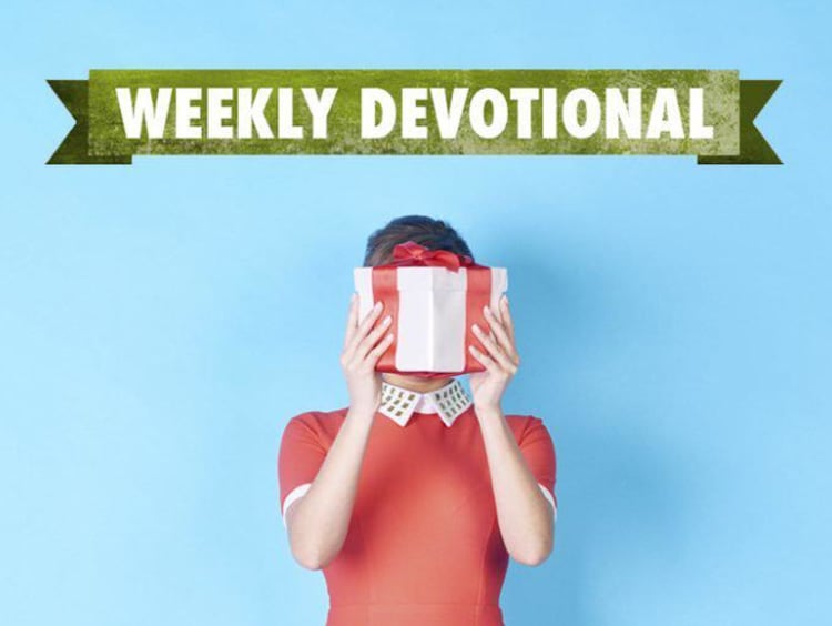 Weekly Devotional: Woman hiding behind a present