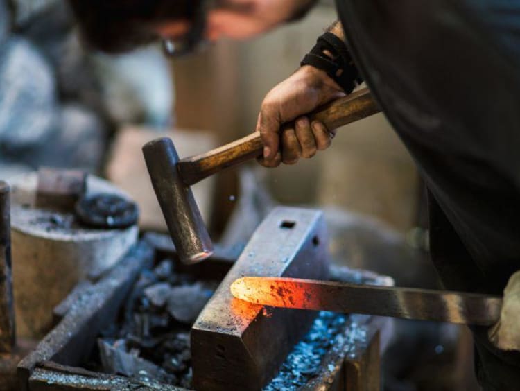 A blacksmith working with metal