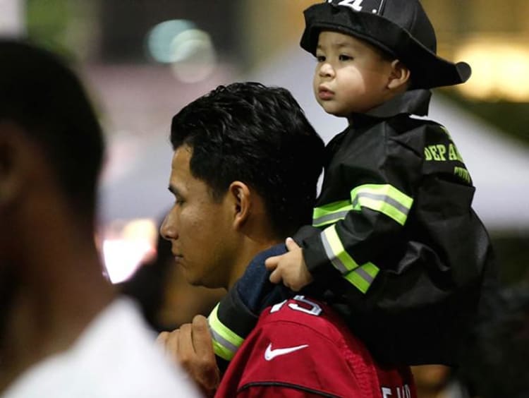 Father with little child on his back