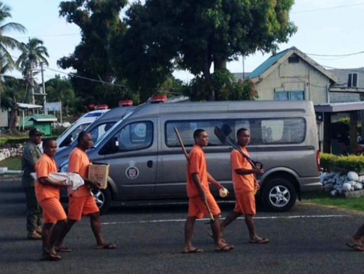 people wearing orange carrying different items