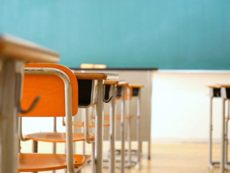 Empty classroom row of desks