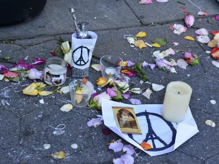 A memorial with candles and flowers