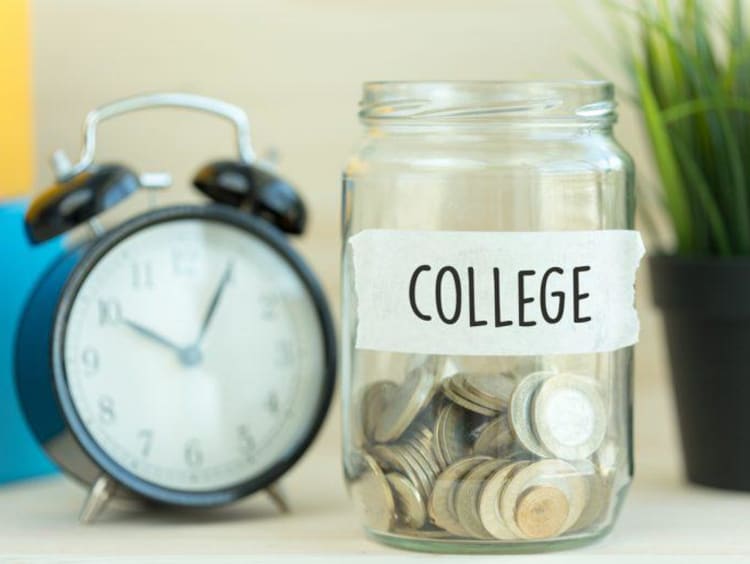 change in a jar labeled college and an alarm clock