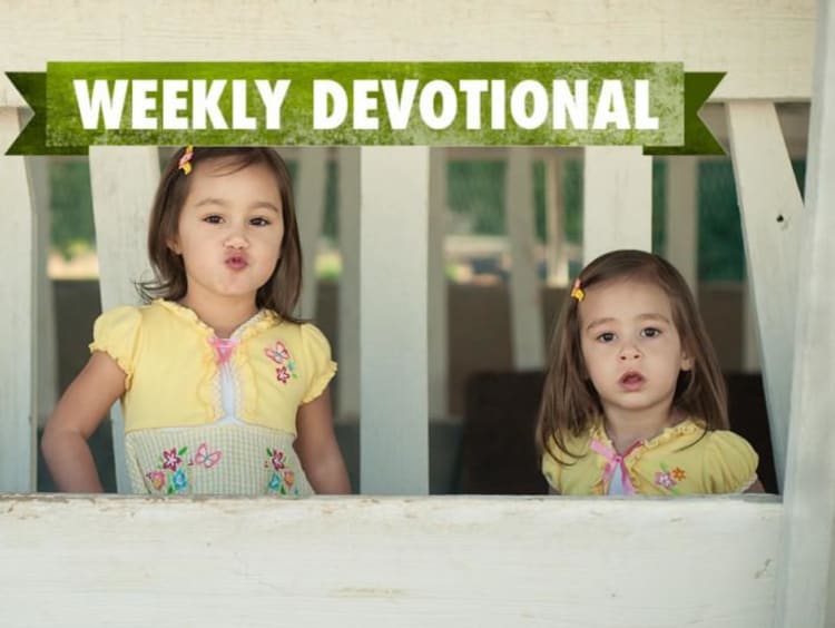 Two girls below the green weekly devotional logo