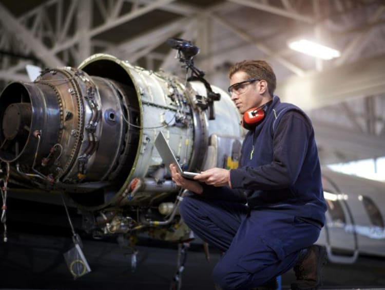 Man working on airplane