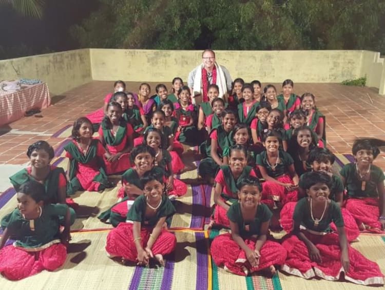 group of children sitting and smiling