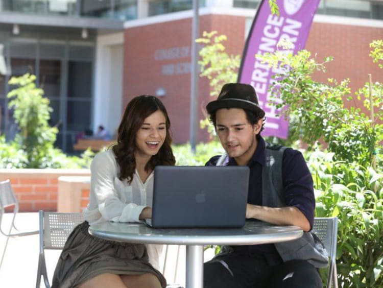 GCU students working together on campus