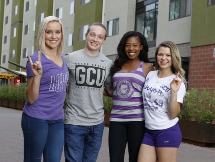 four GCU students smiling