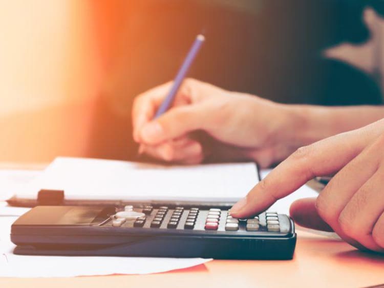 A student doing tuition calculations