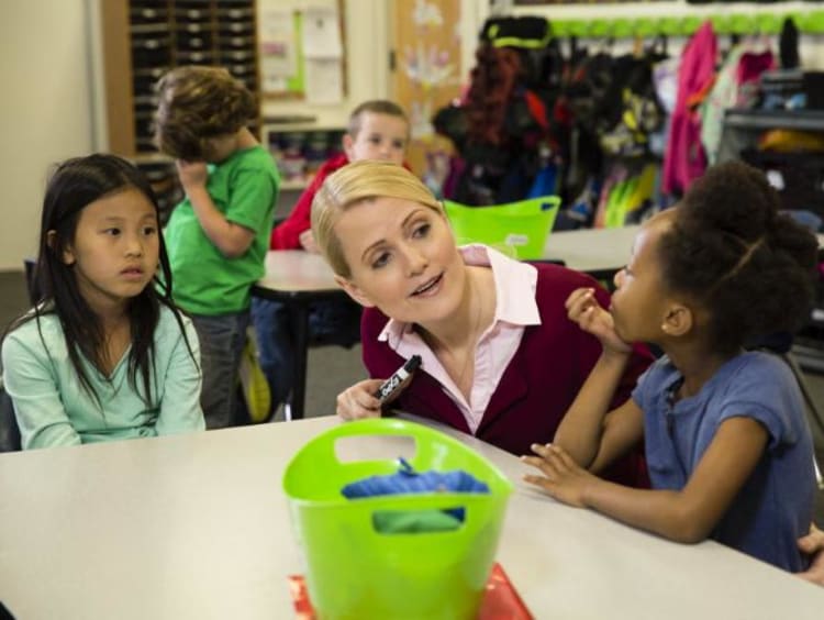 teacher talking with one of her students