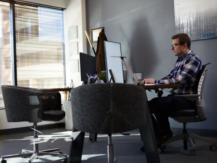 sustainable company leader sitting in his office