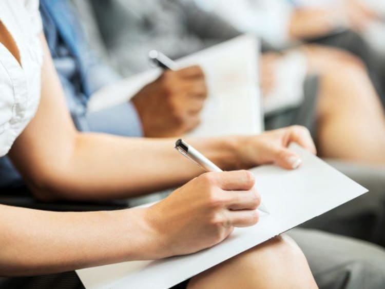 woman writing in a notebook