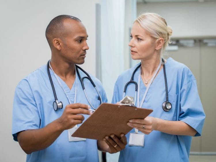 two nurses talking