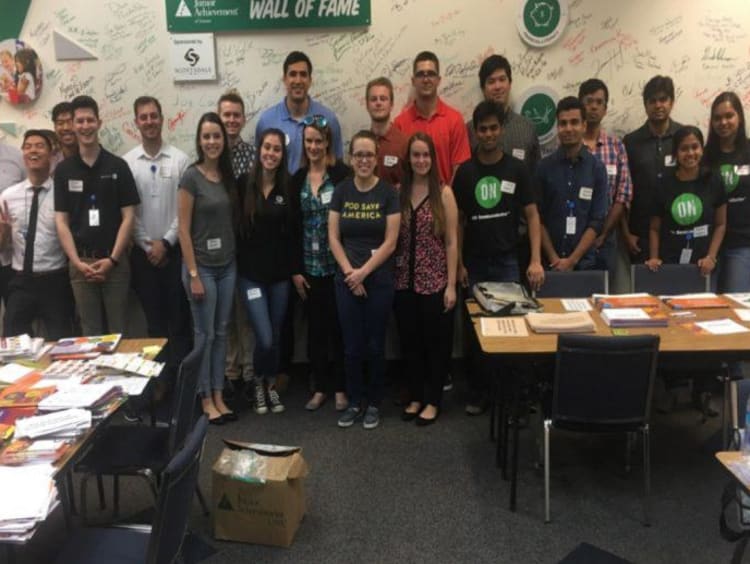 Group of students standing in front of Wall of Fame