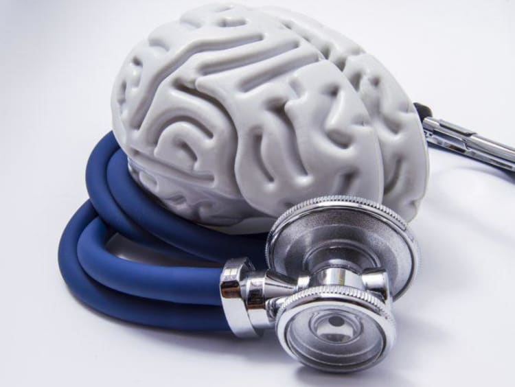 Stethoscope surrounds fake white brain