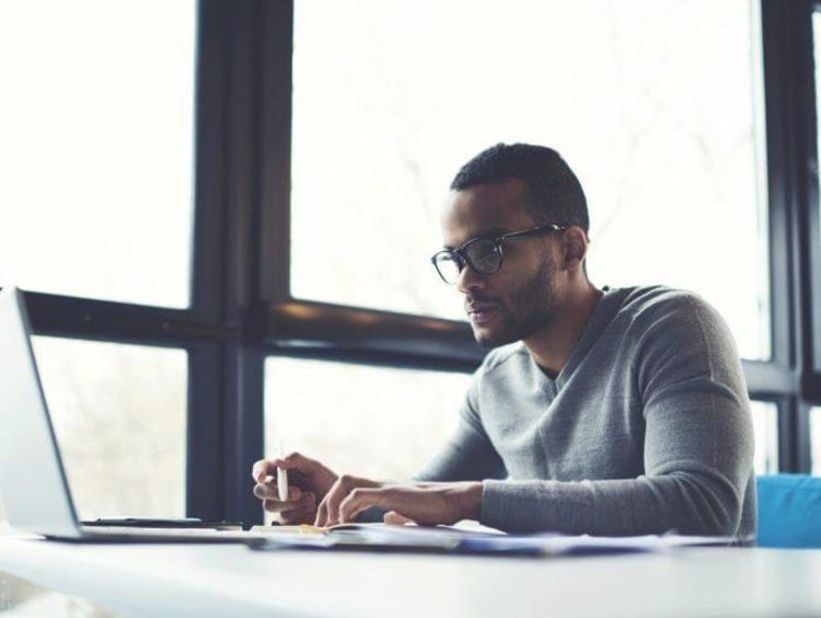 man typing on the computer