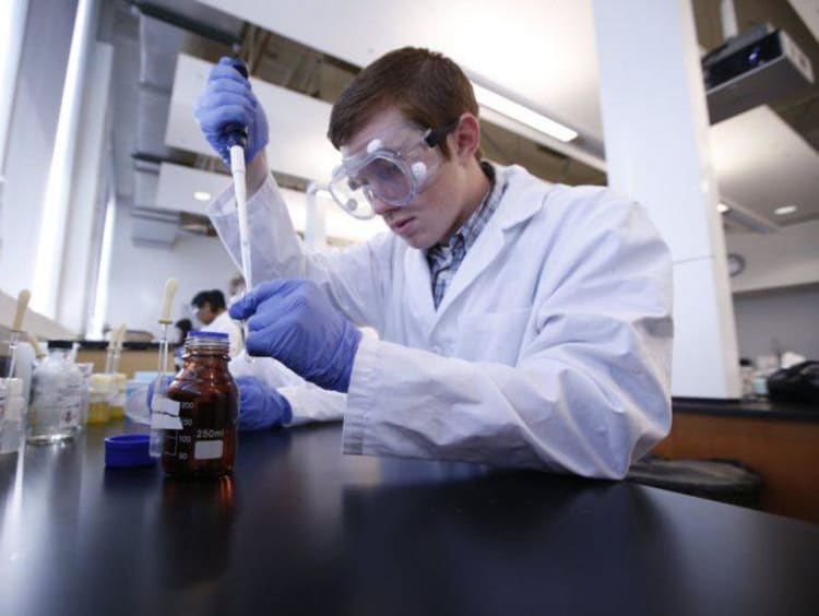 chemistry student working in a lab