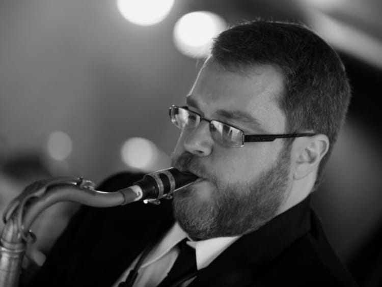 Andrew Gross playing sax