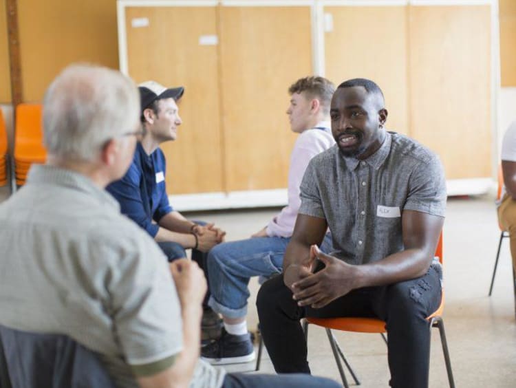 Men talking in community center