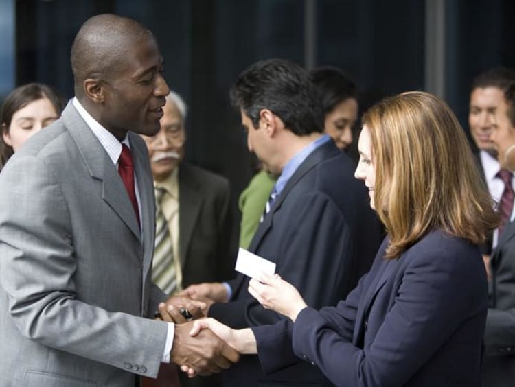 two business people exchanging business cards