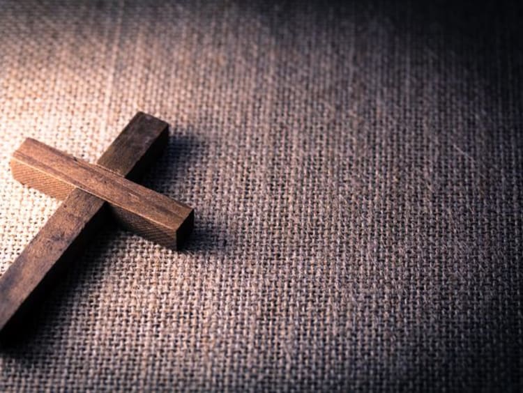 A wooden cross on the floor