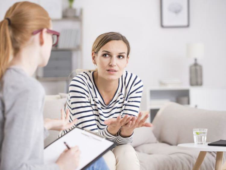 A counselor talking with a patient