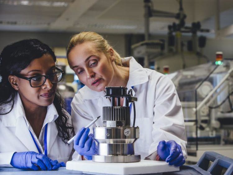 Two biomedical engineers working in a lab