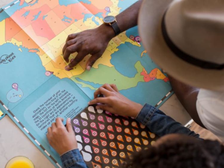 Student and teacher looking at a map