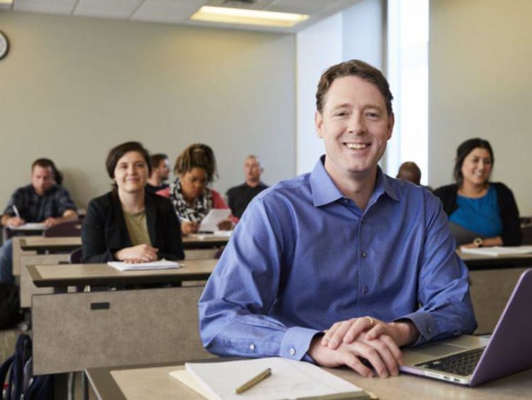 An adult learner in a GCU classroom