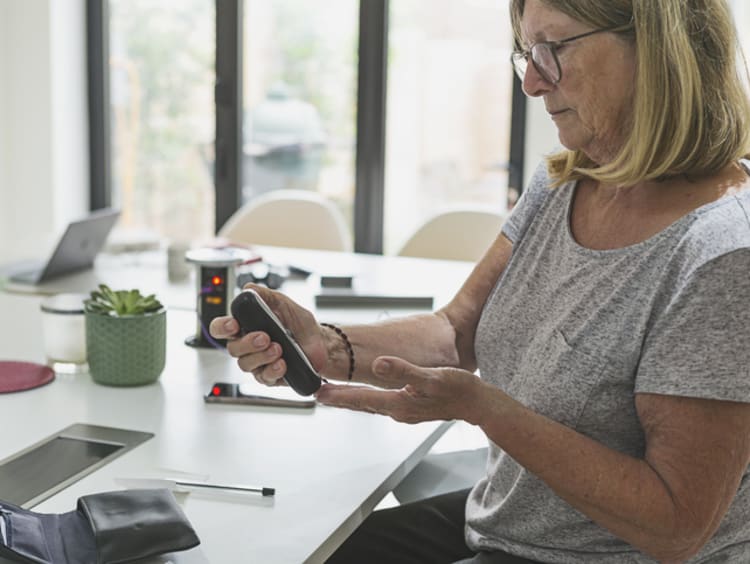 Woman checking her blood sugar levels