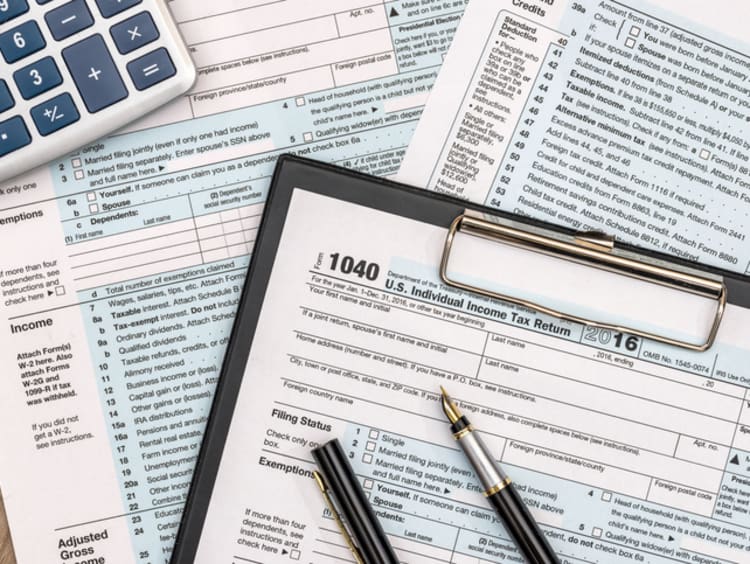 tax forms and paperwork on a table