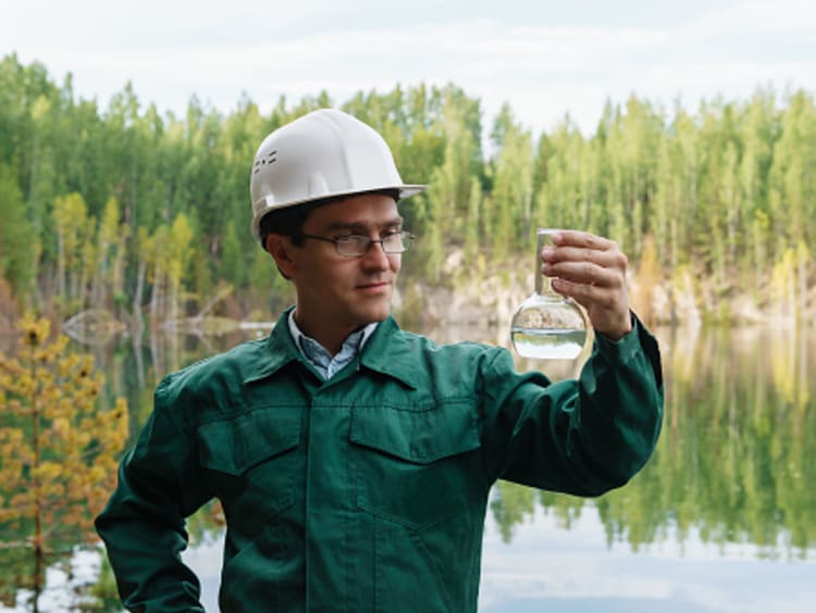 hydrologist collecting water to check environmental health