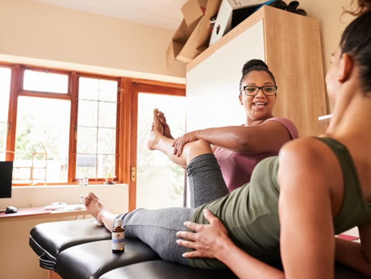 a woman undergoing physical therapy and chiropractic care