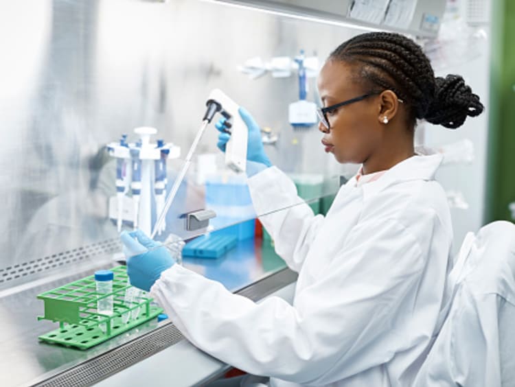 female biochemist testing samples in lab