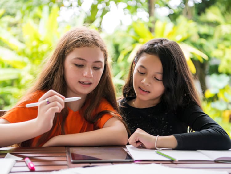 sisters enjoying summer learning activities