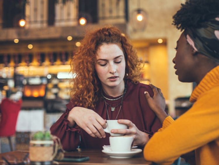 Two girl friends meet for coffee and show confession is good for the soul