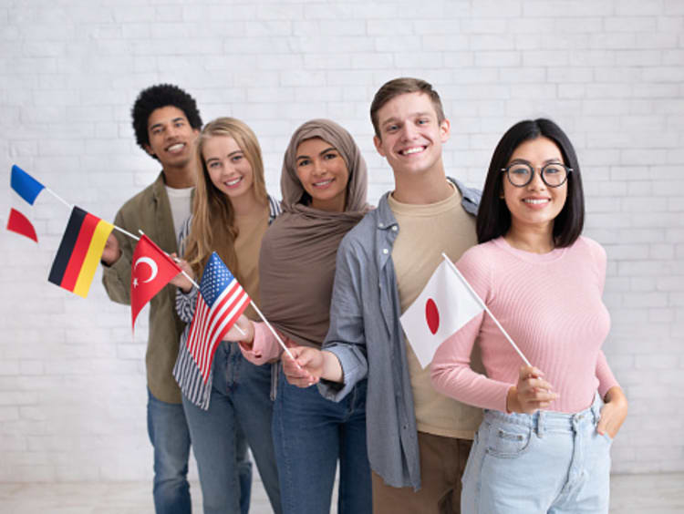 Diverse students holding national flags to support English learners