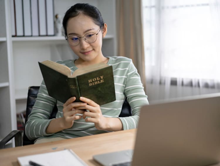 girl working on emotional health by reading the Bible