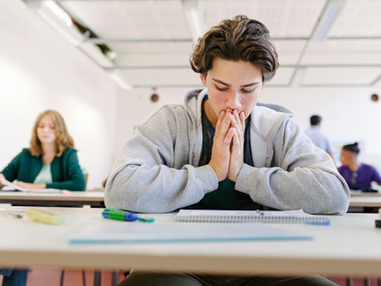 Student praying and learning about God and work