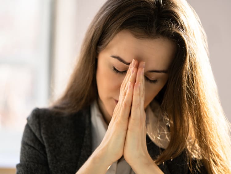 Woman praying since she has a love for God