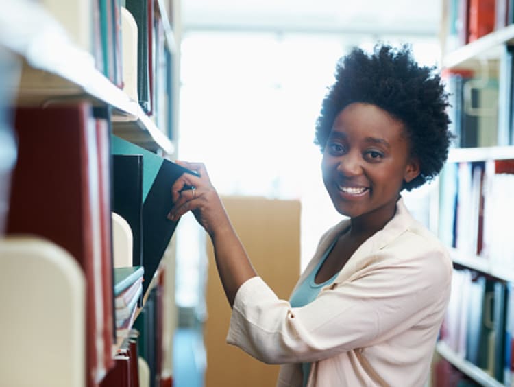 Woman searches for resources for her dissertation