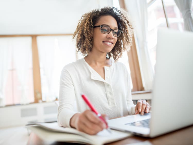 Female medical writer working from home office