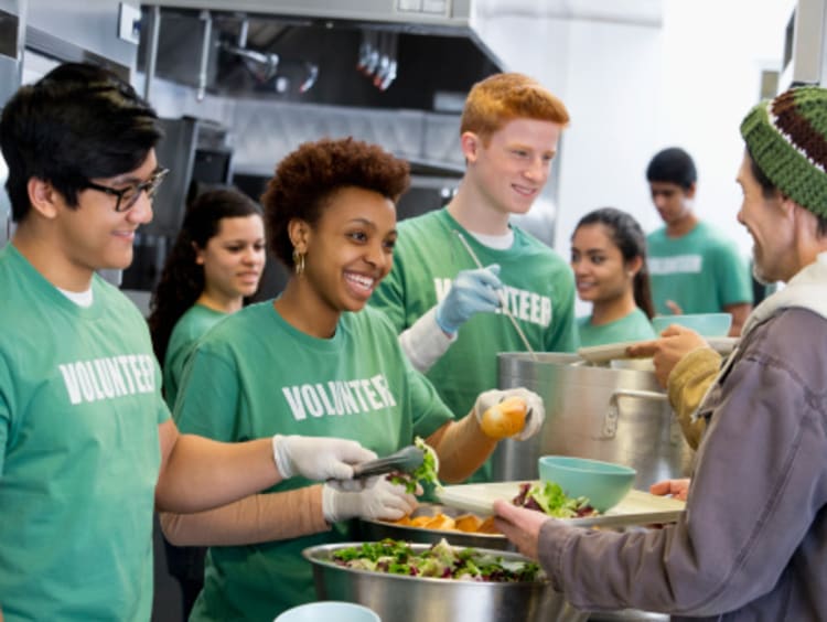 Volunteers in soup kitchen experiencing the gift of work