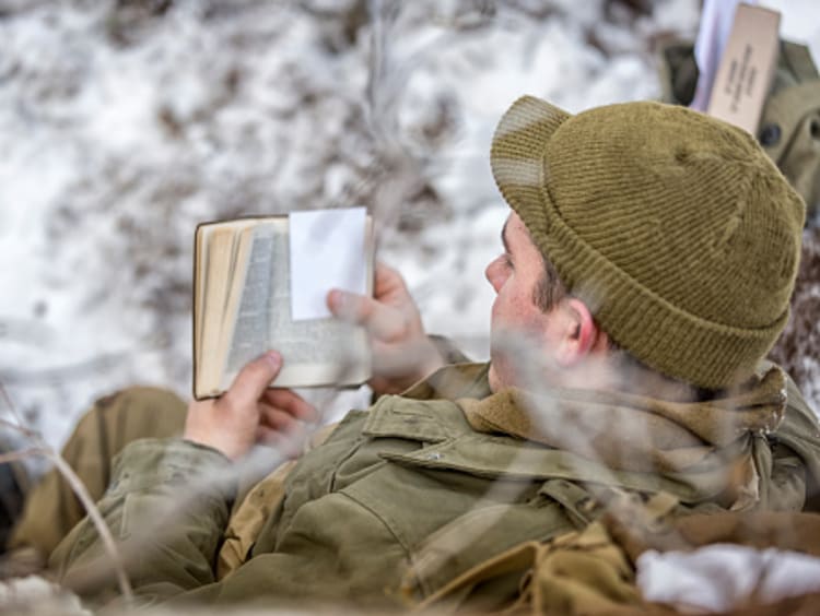 soldier reading the Bible for a biblical perspective on war