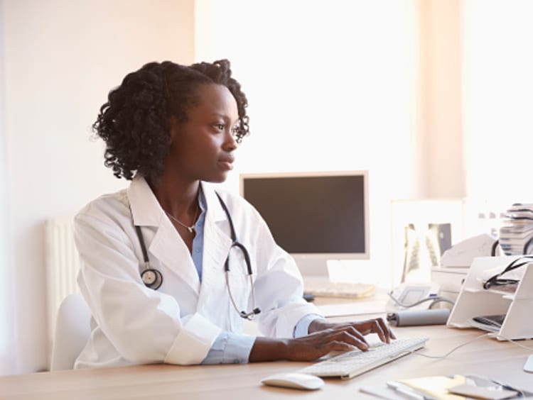 clinical research specialist working on the computer