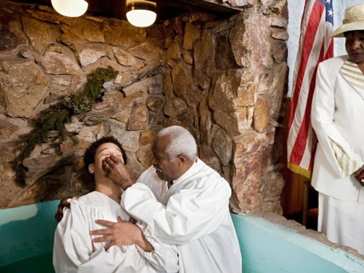 Man getting baptized showing his identity in Christ