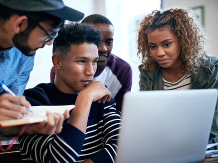 Technology degree students working on digital project
