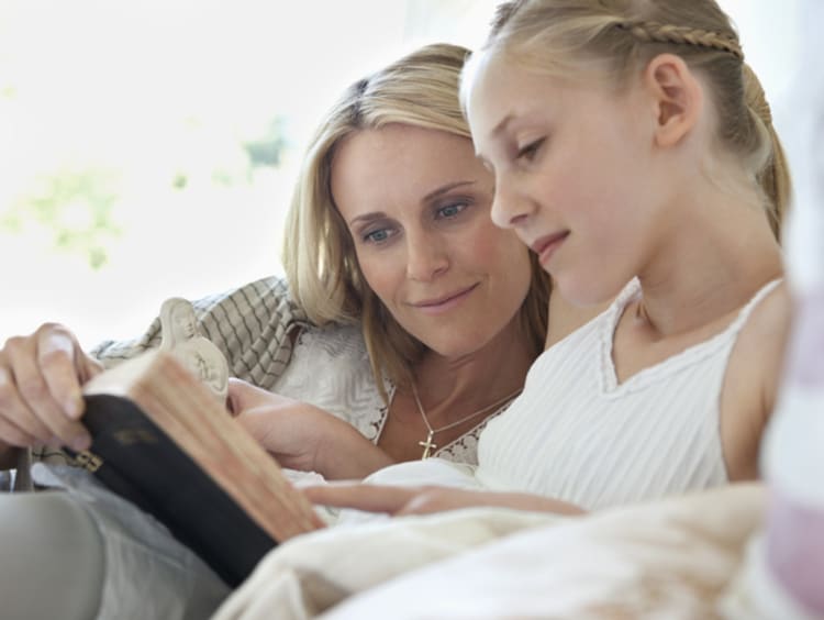 mom and girl reading Bible