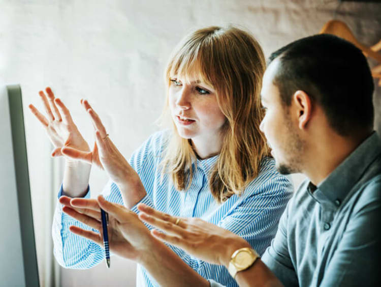 communication specialists problem solving together in an office