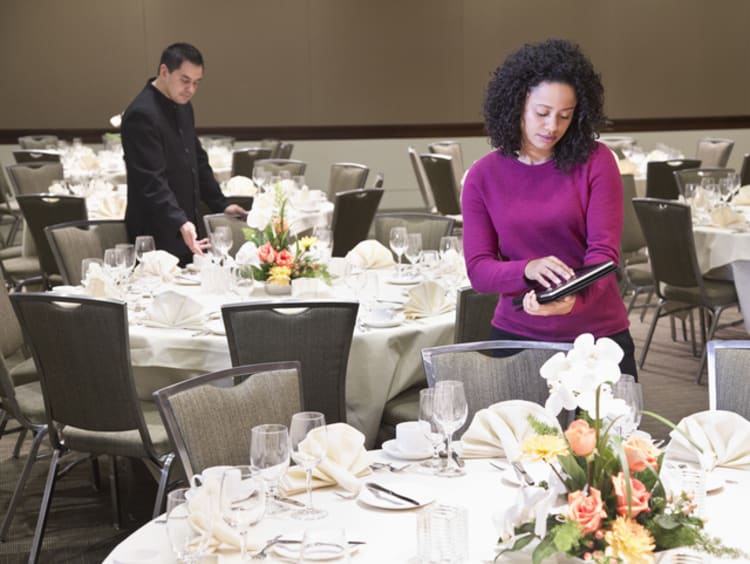 Event planner sets up a wedding in banquet hall